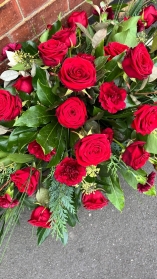 Red rose & carnation casket spray