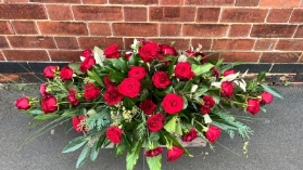 Red rose & carnation casket spray